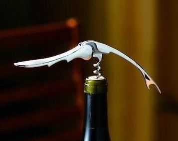 Suwada Wine Opener, presented on a bottle as a gift